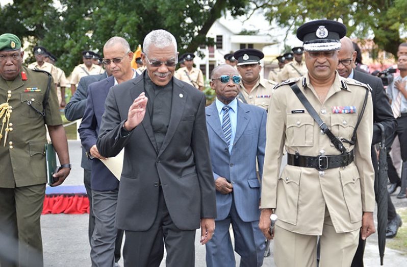 President David Granger being escorted into the conference hall by Commissioner of Police, Seelall Persaud. Also in photo is Minister of Foreign Affairs, Carl
Greenidge (Samuel Maughn photo)