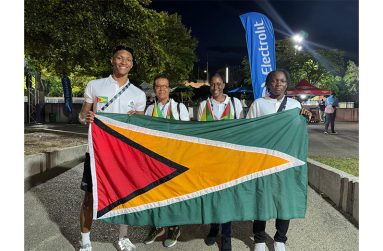 : Olympic swimmer Raekwon noel, Coach Mary Chung, GASA official Abigail Gittens and swimmier Shareefah Lewis