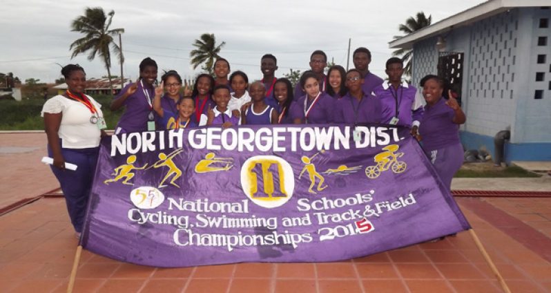 Number one! The North Georgetown District 11 celebrating their win of the swimming competition of the National Schools Cycling, Swimming and Track and Field Championships, yesterday