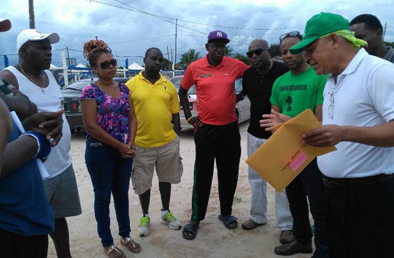 Social Cohesion Minister Dr. George Norton (first from right) addresses Linden stakeholders during his visit.