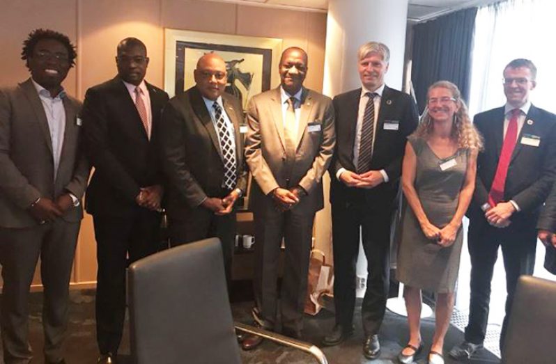 Minister of State Joseph Harmon, Minister of Natural Resources Raphael Trotman and Minister of Public Infrastructure, David Patterson, along with the Norwegian ministerial team in Oslo, Norway.