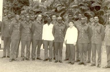 Prior to 1970, there were Instruments of Commission or State Warrants. Officers commissioned were published in the Official Gazzette. On attainment of Republican status, the State Commission was introduced and all officers at the time of the were given instruments dated February 23rd, 1970 in the rank they were holding on that day. The instruments were actually given out by President Arthur Chung in 1972. This picture was of the the first ceremony. From left to right are Captain Ramesh Ramharack ( ADC), Dapt Keith Dyer, Major Neil Benjamin (Chaplin), Major David Granger, Major William (Rex) Owen, Major Carl Morgan, Lieutenant Colonel Leonard (Charlie) Muss, Mr Oscar Henry (PS OPM /Secretary of the Def Board). Captain RB Mitchell, Brigadier CAL Price (COS), Major Desmond Roberts, President Arthur Chung, Captain Marcus Munroe, Colonel Ulric Pilgrim, Major Joseph Singh, Lieutenant Colonel Vernon Williams, and Captain Pat Smith. (Photo submitted by Colonel (Rtd) Carl Morgan)