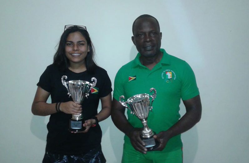 Krystol Chanderban and Deion Nurse with their winner’s trophies.