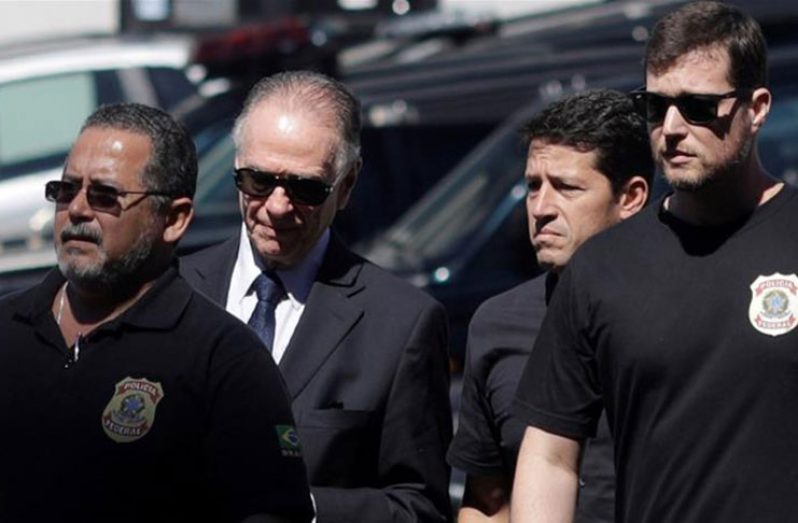 Carlos Nuzman (second left) arrives at the federal Police headquarters in Rio de Janeiro. (Ricardo Moraes/Reuters)