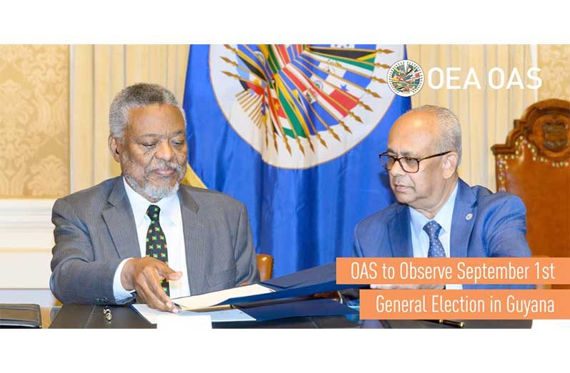 Permanent Representative of Guyana to the OAS, Samuel Hinds and General Secretary Albert Ramdin during Monday’s signing agreement