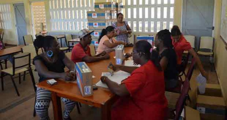 Residents completing the required documentation before receiving their laptops
