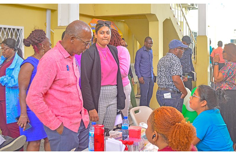 Minister Joseph Hamilton at an exhibition booth on Wednesday