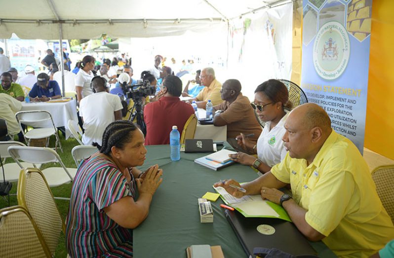 Minister of Natural Resources, Minister Raphael Trotman, interacts with residents (Samuel Maughn photo)
