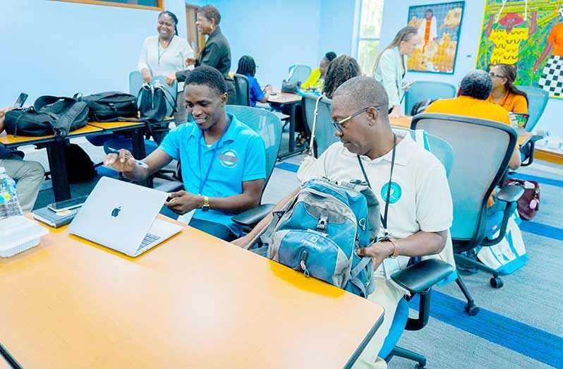 Owen Paul of Guyana's CDC (right) - pictured with colleague from Jamaica's Office of Disaster Preparedness and Emergency Management (ODPEM) (photo credit: Kareem Smith)