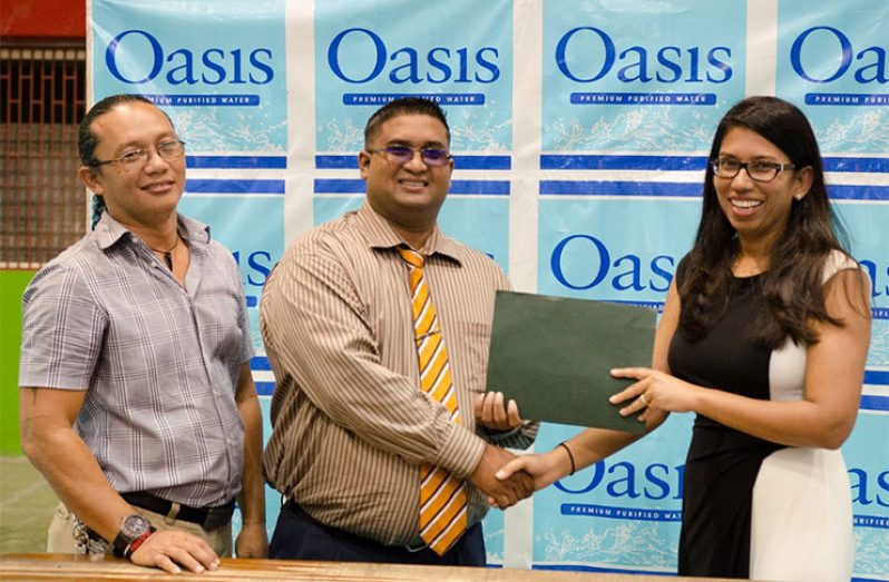 At the Partnership Collaboration: From left, Head Coach Mr. Nicholas Hing, Brand Manager of Guyana Beverages Inc. Mr. Raymond Govinda and Archery Guyana’s Secretary-General, Mrs. Vidushi Persaud-McKinnon.