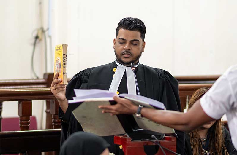 Rodley Meren Mathoo taking an oath before being formally admitted to practise law as an attorney (Delano Williams photo)
