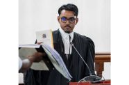 Fenton Jonathan Budhram taking an oath before being formally admitted to practise law as an attorney