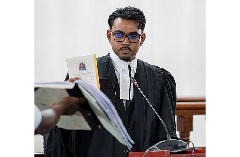 Fenton Jonathan Budhram taking an oath before being formally admitted to practise law as an attorney