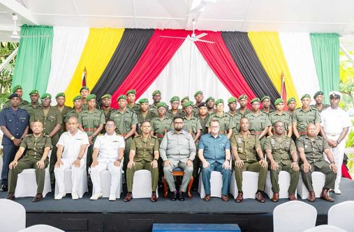 The newly commissioned Second Lieutenants and Warrant Officers, along with President Dr. Irfaan Ali (seated at centre); Chief of Defence Staff Brigadier Omar Khan (seated fourth left), and National Security Adviser, Captain Gerry Gouveia along with other senior officers