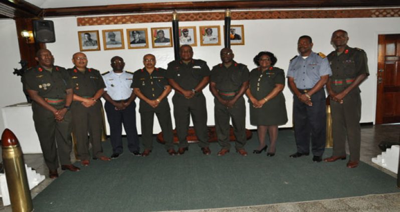 Chief-of-Staff, Brigadier Mark Phillips (centre) with, from left, newly-promoted Colonels Paul Arthur, Nazrul Hussain, Cargill Kyte, Jawahar Persaud, Patrick West, Ann Mc Lenan, Gary Beaton and Wilbert Lee (Photos courtesy GDF)