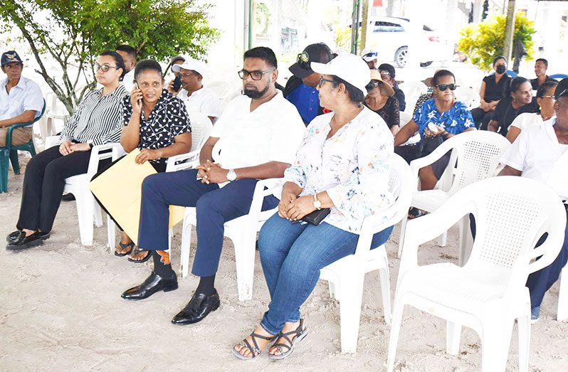 President, Dr. Irfaan Ali flanked by the wife of Don Trevor Patrick, Chairperson of Region Two, Vilma De Silva and Minister within the Ministry of Housing and Water, Susan Rodrigues, at the funeral service, on Saturday