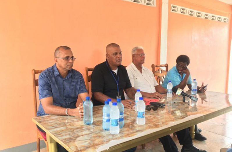 From left: GRDB General Manager, Nizam Hassan; Prime Minister’s Regional Representative, Gobin Harbhajan;  Agriculture Minister, Noel Holder and NDIA CEO, Fredricks Flatts at the meeting with rice farmers on Friday .