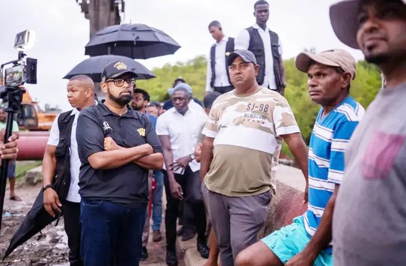 President Dr. Irfaan Ali interacting with fishermen at Ogle (Office of the President photos)