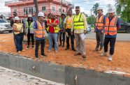 Minister of Public Works, Bishop Juan Edghill, project manager, contractor, and consultants during his Ogle to Eccles four-lane highway site inspection