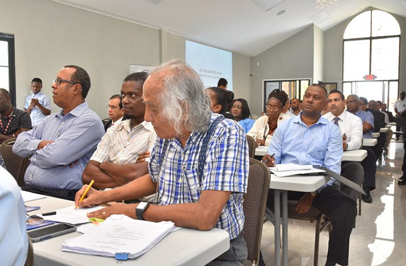 Chartered Accountant Christopher Ram makes notes during the forum on Tuesday