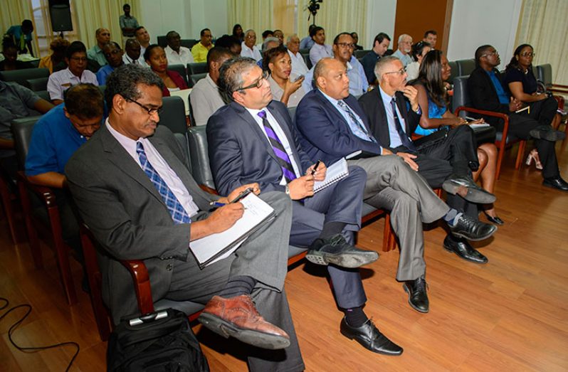 A section of the participants at Monday’s forum on oil and gas held at the Arthur Chung Convention Centre, Liliendaal. (Front Row L- R) Anthony Paul, Advisor to the Ministry on Oil and Gas, Arnold Niranjan, Regional Service Line Leader, Advisory Services, EY Global, Minister of Natural Reources, Raphael Trotman, Minister of Business and Tourism, Dominic Gaskin, businesswoman Allison Butters-Grant, and Minister of Public Infrastructure, David Patterson listen to a presentation on oil and gas on Monday at the Arthur Chung Convention Centre