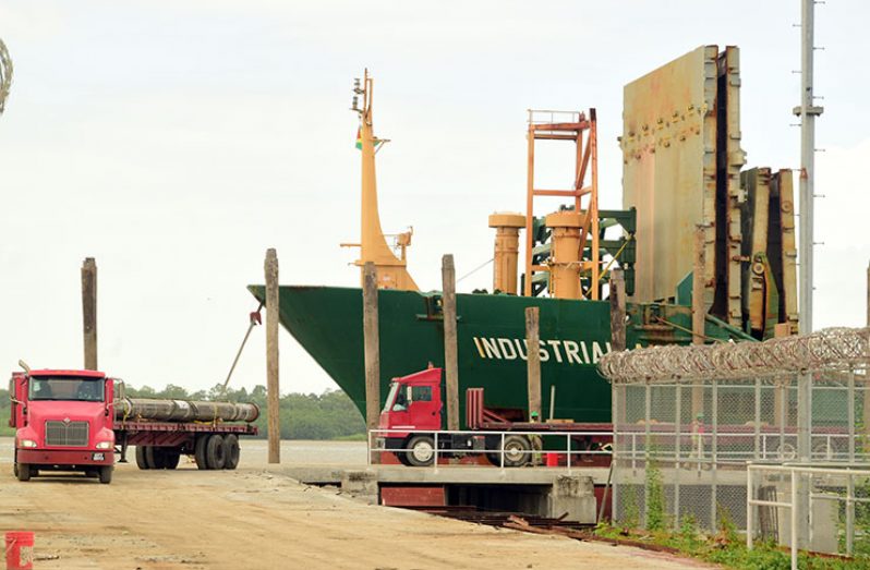 Equipment being offloaded from a ship at the Muneshwers Wharf into the Exxon-Shore base (Adrian Narine photo)
