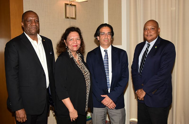 Taking a breather during Monday’s oil and gas workshop are, from left, Minister of State Joseph Harmon; World Bank’s Ms Tahseen Sayed Khan and a colleague of hers and Minister of Natural Resources, Mr Raphael Trotman (Photo by Adrian Narine)