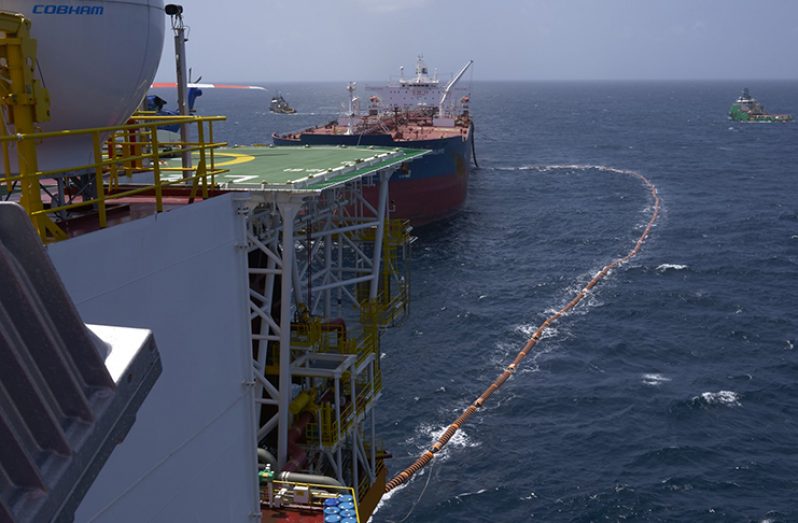 Flashback- The fuel hose leads from the Liza Destiny to the Cap Philippe for the transfer of Guyana’s first million barrels of crude (Ministry of the Presidency photo)