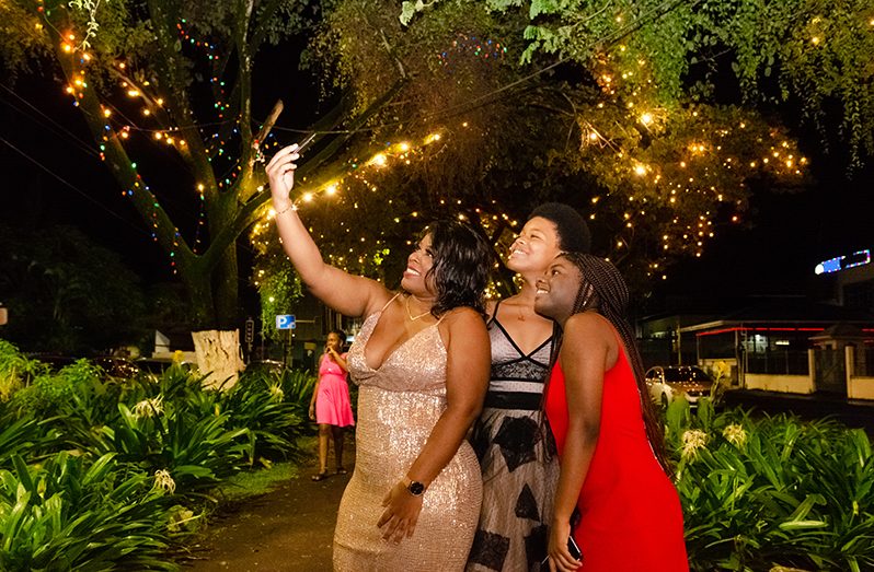 Melissa and her nieces took advantage of the light display on Main Street to snap that Old year’s night selfie (Delano Williams photo)