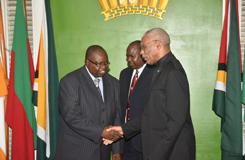 President David Granger stands alongside retired Judge,Winston Patterson on Wednesday at State House after he (Patterson) was sworn in as Ombudsman (Adrian Narine photo)