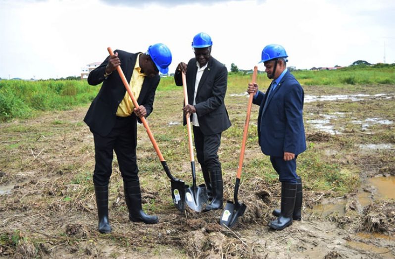 Minister of Public Infrastructure , David Patterson (left); GCAA Director-General, Lieutenant Colonel (Re’td),Egbert Field and Minister within the Ministry of Public Infrastructure , Jaipaul Sharma (right) turn the sod on the spot where the new GCAA headquarters will be built