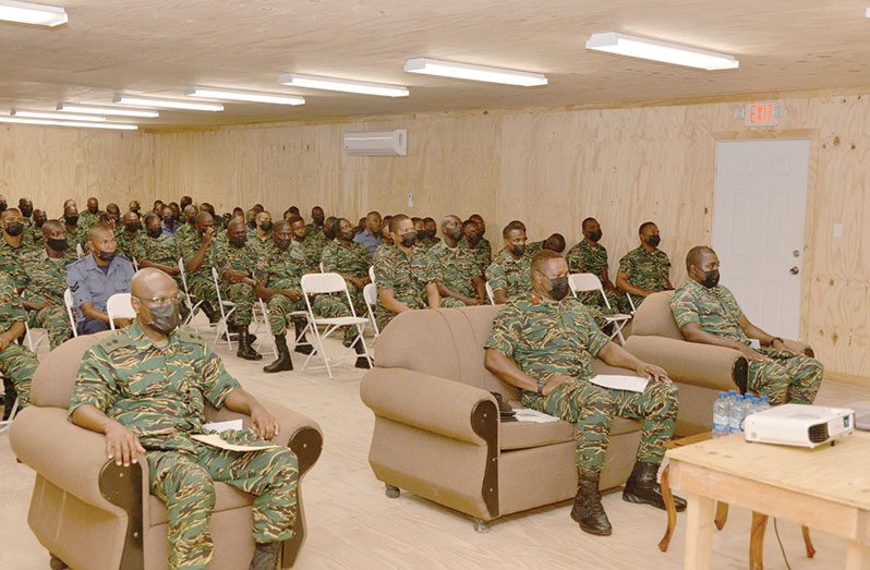 Commanding Officer Training Corps, Colonel, Collin Henry (seated left); Commandant Guyana People's Militia, Colonel, Trevor Bowman (seated centre) with the staff and students of PSC and SCC during the opening ceremony