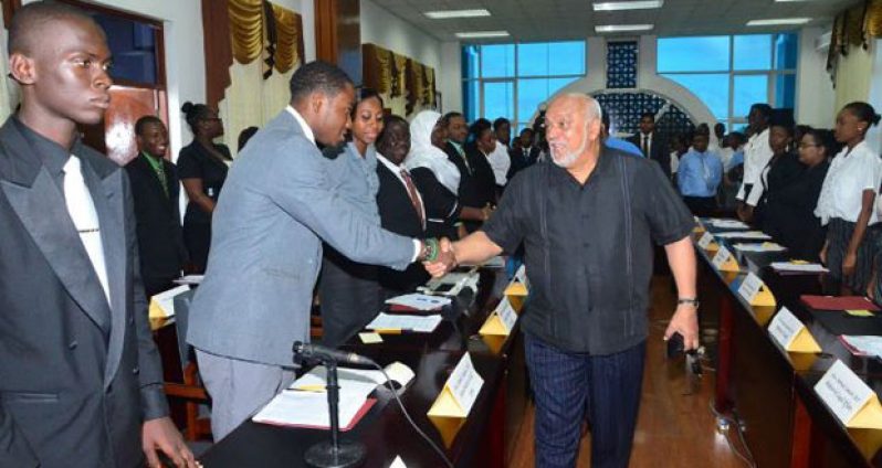 President Donald Ramotar greeting ‘opposition’ members of the National Youth Parliament at the Guyana International Conference Centre