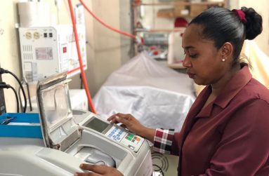 Operating a machine to help make her work easier