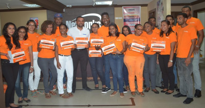 E-Networks’ Vishok Persaud and staff at yesterday’s OrangeBox launch (Photo by Cullen Best-Nelson)