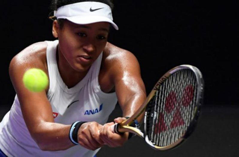 Naomi Osaka has been forced out of the WTA Finals with a shoulder injury (AFP Photo/NOEL CELIS)