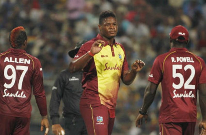 Fast bowler Oshane Thomas (centre) celebrates another wicket in Sunday’s T20 International with Fabian Allen and Rovman Powell. (Photo courtesy BCCI Media)