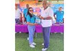 Flashback: GSCL Secretary Telesha Ousman, presents a ball to Prime Minister Mark Anthony Phillips at last year’s launching