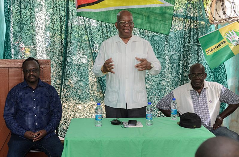 Minister of Finance, Winston Jordan flanked by members of the coalition during the community outreach, on Monday (Delano Williams photo)