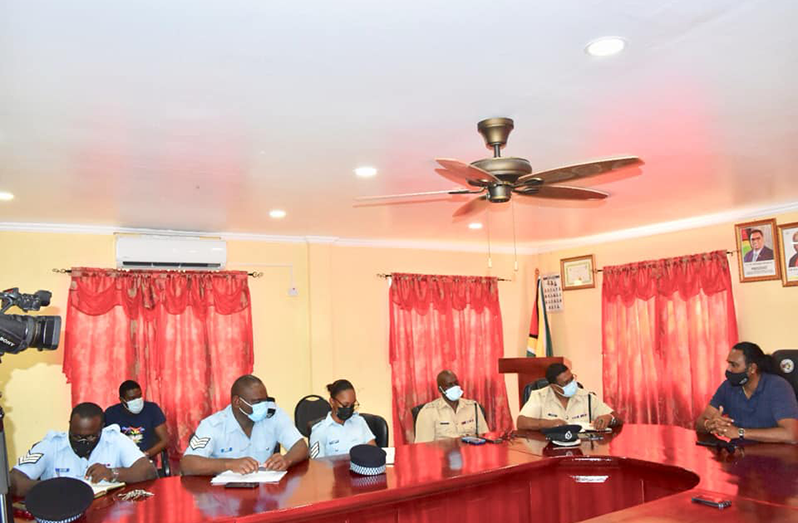 Director of CCU, Mark Ramotar (extreme right) next to Region One commander, Superintendent Khalid Mandall and other ranks during a recent meeting in the boardroom of the Regional Democratic Council (RDC), Region One