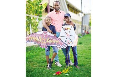 Horaytus and his sons, Othaniel (right)  and Emmanuel (left), are a beautiful reminder that some traditions, no matter how they evolve, remain deeply connected to the things that matter most: family and faith (Samuel Maughn photo)