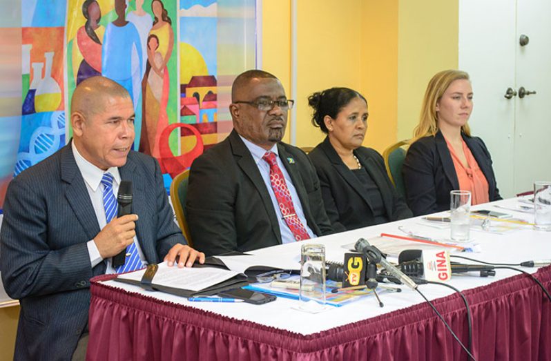 Public Health Minister Dr. George Norton addressing reporters at Cara Lodge Hotel in the presence of PANCAP Director Dereck Springer; K4Health PANCAP Knowledge Management Coordinator Dr. Shanti Singh-Anthony, and Knowledge Management Advisor from Johns Hopkins University, Sarah Fohl