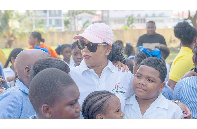 Minster of Education, Sonia Parag, flanked by pupils of the North Georgetown Primary School (Japheth Savory photos)