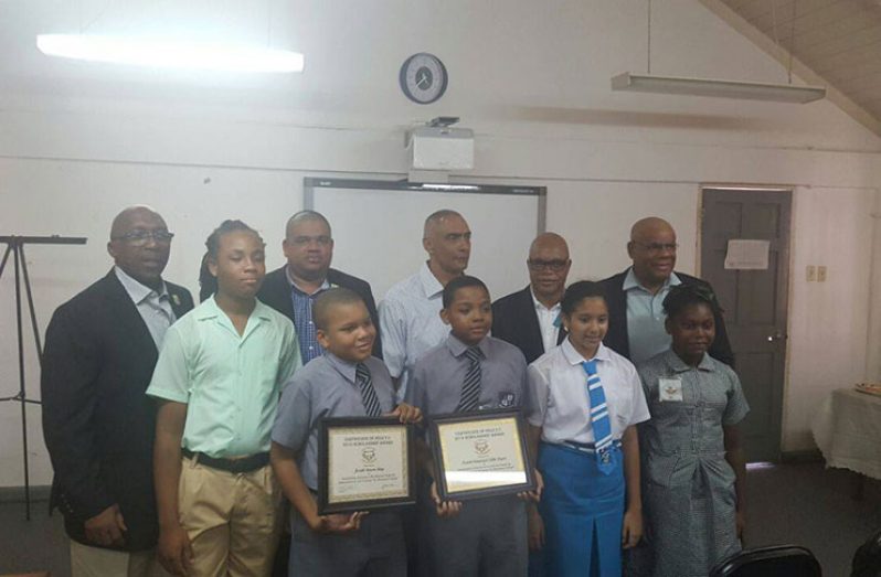 L-R, back row, Dennis Carrington, Robbie Rambarran, David Gomes, Patrick Barton and David Chan. L-R front row: Joshua Denny, Josiah King, Isaiah Layne, Sara Matthias and Reshana Bishop.