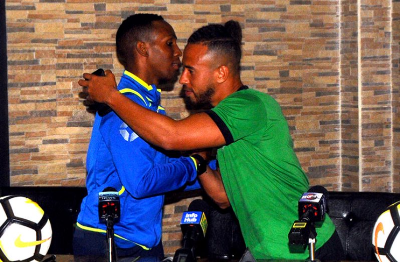 The calm before the storm! Golden Jaguars skipper Samuel Cox (right) greets his Barbados counterpart Aiden Hooligan at yesterday’s press conference. (Adrian Narine photos)