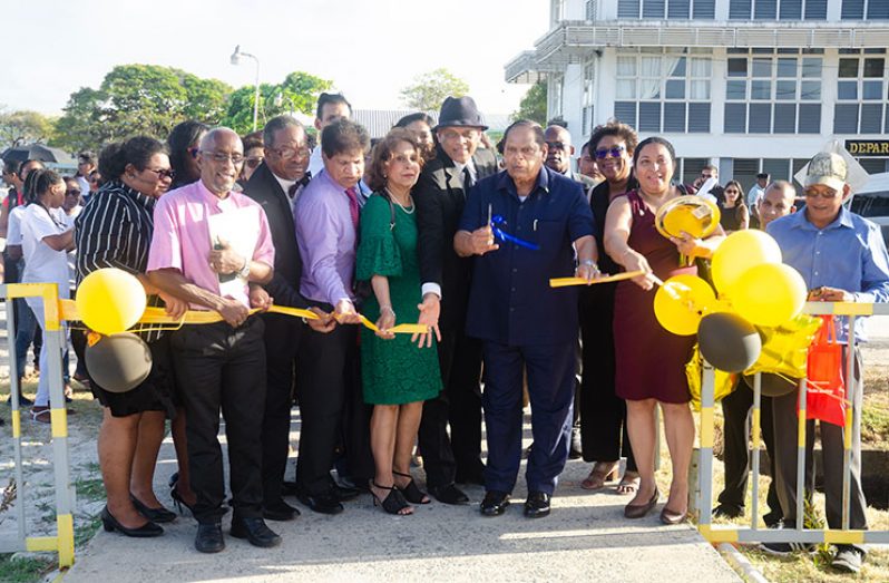 Acting President and Prime Minister, Moses Nagamootoo, cut the ribbon to formally open the Jay and Sylvia Sobhraj Centre of Behavioural Sciences and Research. He was flanked by Jay and Sylvia Sobhraj, Deputy Vice-Chancellor, Professor Paloma Mohamed, and other officials (Delano Williams photo)