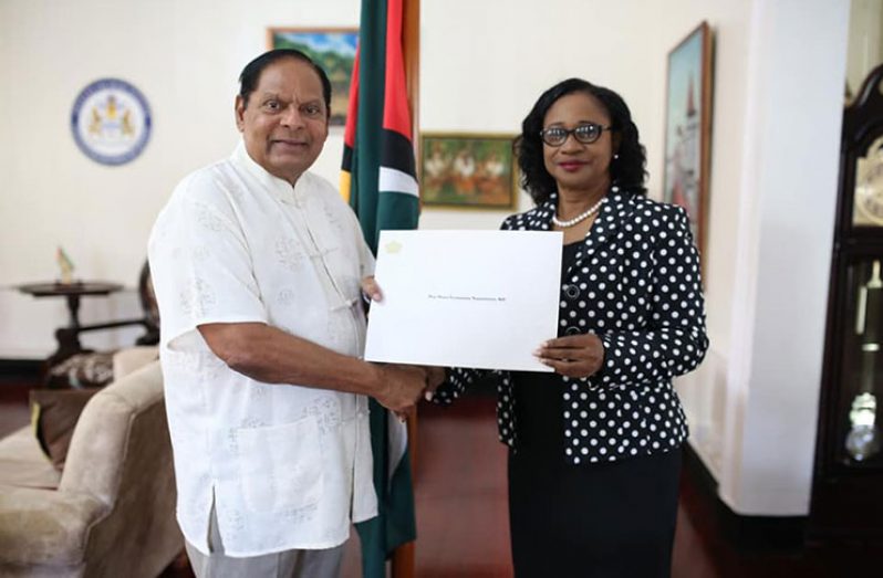 Prime Minister, Moses Nagamootoo receives his instrument of appointment from Chancellor of the Judiciary, Justice Yonette Cummings-Edwards