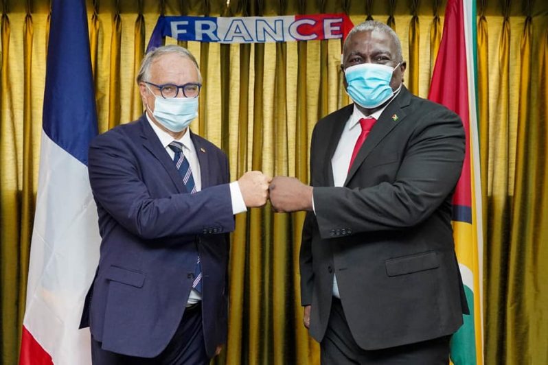 Prime Minister Brigadier (Ret’d) Mark Phillips (right), with Non-Resident Ambassador of the French Republic to Guyana, Antoine Joly, at the reception in honour of the upcoming French National Day (Bastille Day) (Office of the Prime Minister photo)