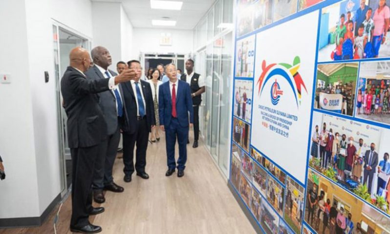 Prime Minister, Brigadier (Ret'd) Mark Phillips; President of CPGL, Liu Xiaoxiang and other officials tour the CNOOC facility on Friday (Office of the Prime Minister photo)
