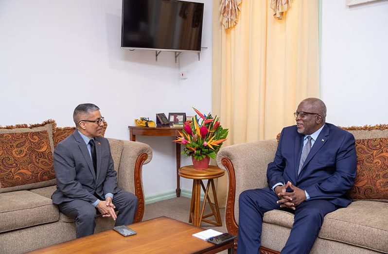 Prime Minister, Brigadier (Ret’d) Mark Phillips and Venezuela’s Ambassador to Guyana Carlos Amador Perez Silva in discussion on Tuesday